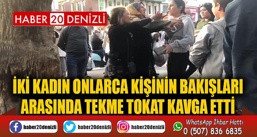 İki kadın onlarca kişinin bakışları arasında tekme tokat kavga etti