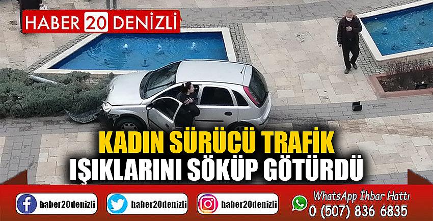 Kadın sürücü trafik ışıklarını söküp götürdü