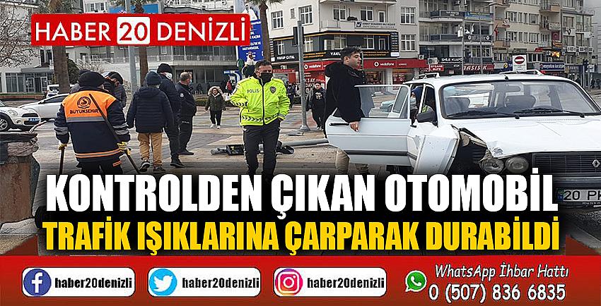 Kontrolden çıkan otomobil trafik ışıklarına çarparak durabildi