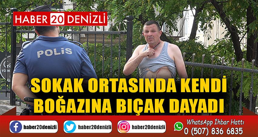 Sokak ortasında kendi boğazına bıçak dayadı